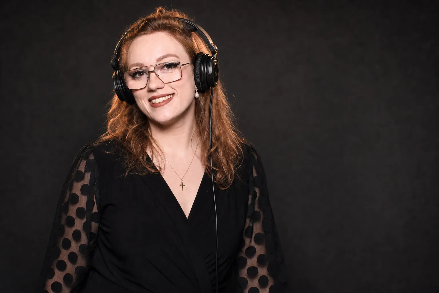 DJ Allie of Sound of Harmony wearing DJ headphones and smiling, wedding DJ for Niagara, Hamilton and the Greater Toronto Area