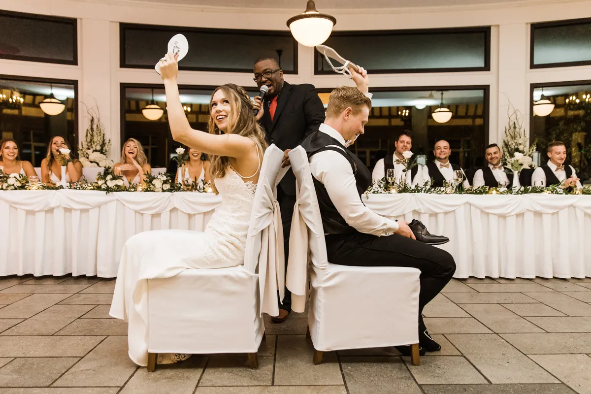 MC-led shoe game with the full bridal party at a Niagara wedding reception