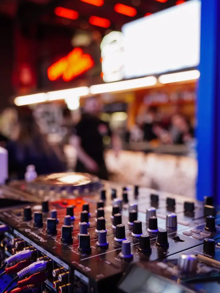DJ booth with warm uplighting inside a historic Niagara-on-the-Lake venue