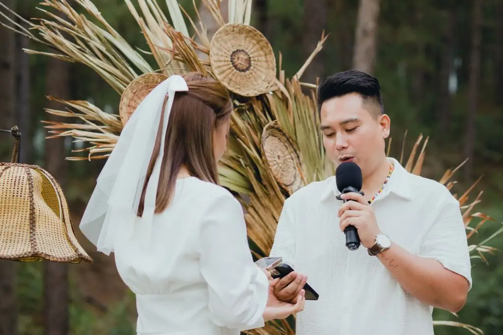 Outdoor wedding ceremony in Niagara region with discreet speaker on a stand and lapel mic
